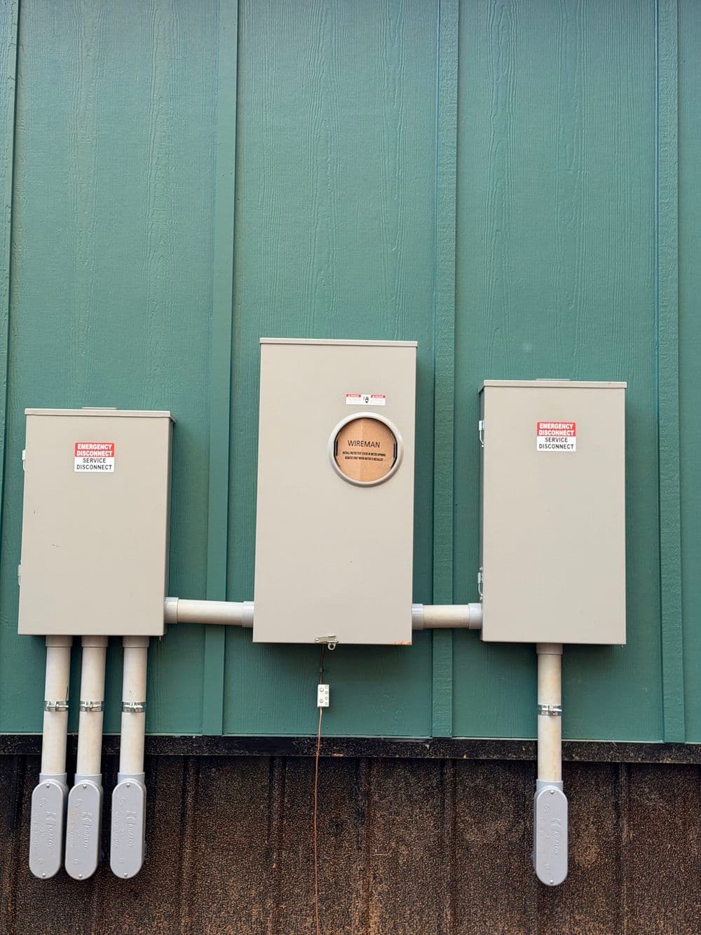 Interior of a customizable van conversion, featuring wood paneling and LED lights.